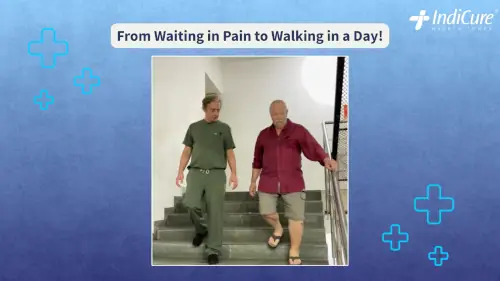 Russell Eddy is being assisted by his surgeon as he successfully walks down a flight of stairs in the hospital just one day after his hip replacement surgery.